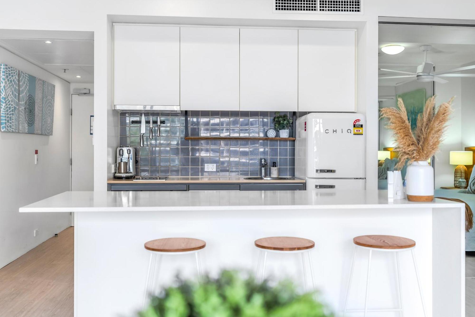 'escape At Harbour Lights' Poolside Chic In The Apartment Cairns